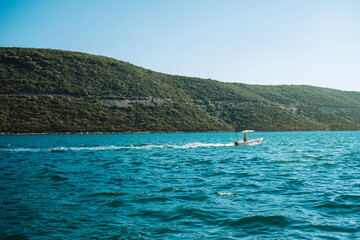 sailing boat on the sea in distance