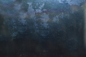 Grunge on a dark blue background with scratches and lint on the surface