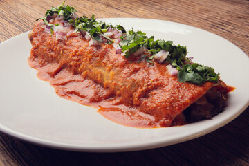 Traditional mexican gourmet food. Gourmet mexican food with chili peppers. Mexican traditional food gourmet on table. Exotic mexican food. Mexican burrito.