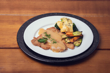 Traditional mexican gourmet. Gourmet mexican food with chili peppers. Mexican traditional food gourmet on table. Exotic mexican food. Mexican chicken milanesa
