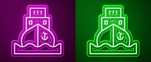 Glowing neon line Cargo ship icon isolated on purple and green background. Vector.