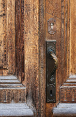 Saint Petersburg, Russia - July 17, 2020, old vintage door handle on a wooden door