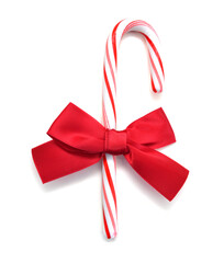 Candy cane with red bow shot on white background with soft shadow