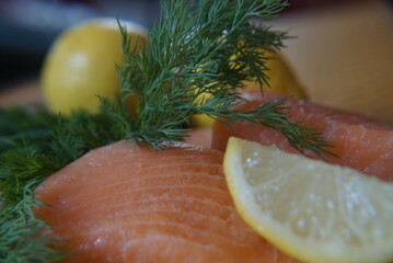 Raw salmon with lemon and dill, ingredients for cooking