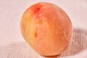 favorite summer fruit hairy peach, very sweet and delicious on textured background
