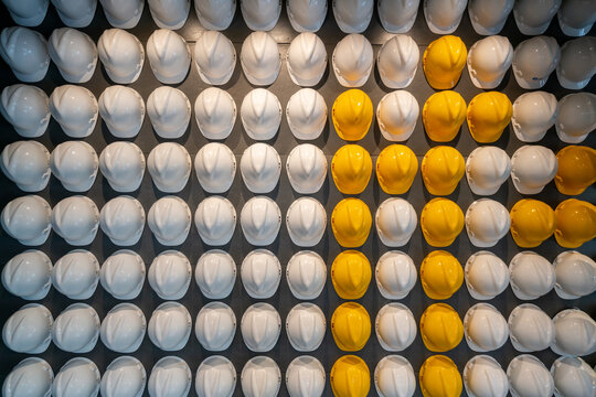 Safety helmets lined up on the wall