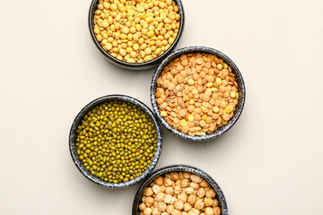 Different raw legumes on white background