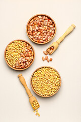 Different raw legumes on white background