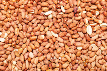 Heap of raw peanuts as background