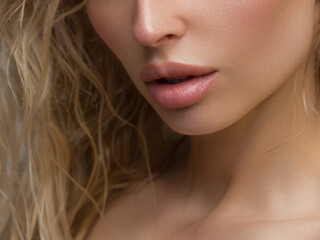 Close-up of woman's Lips with Fashion pink Make-up and Manicure on Nails. Beautiful female full lips with perfect Makeup. Part of female face. Macro shot of beautiful make up on full lips