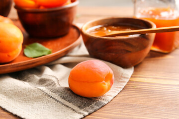 Tasty ripe apricot on table