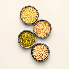 Different raw legumes on white background