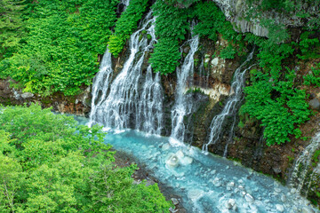 Fototapeta na wymiar 北海道　美瑛町の夏の風景 白髭の滝