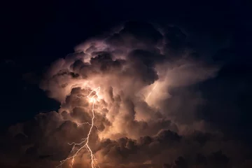 Poster Dark cloud at  night with thunder bolt. Heavy storm bringing thunder, lightnings and rain in summer. © noon@photo