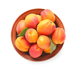 Bowl with tasty ripe apricots on white background