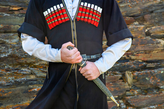 Georgian Man In Traditional Clothes Holding The Dagger, Caucasus Mountains, Georgia