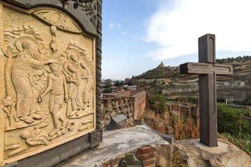Fototapeta na wymiar Relief representing the baptism, on top of the Narikala Castle in Tbilisi, Georgia