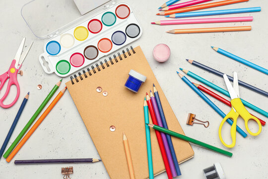 Ordinary pencils with stationery on light background