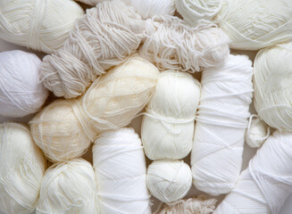 White, light, neutral yarn for knitting. Top view.