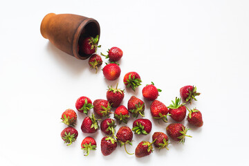 Sweet berries of red strawberries on a white background. Natural environmentally friendly product.