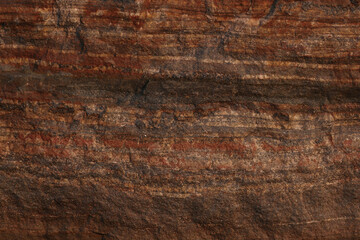 Minerals. Striped stone texture. Layered stones. Brown background. Blank for design. Textured background for interior decoration or packaging. Solid concept.