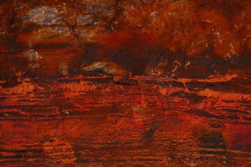 Dark red saturated abstract background. Minerals. Stone texture. Blank for design. Textured background for interior decoration or packaging. Solid concept.