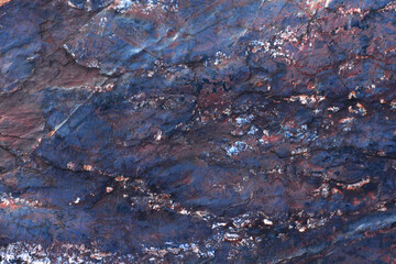 Iron ore close-up. Minerals. Abstract dark blue pattern. Blank for design. Textured background for...