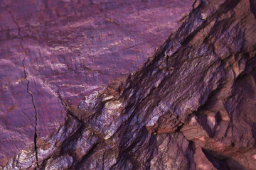 Violet metallic color. Minerals. Iron ore. Vertical stone texture pattern. Blank for design....