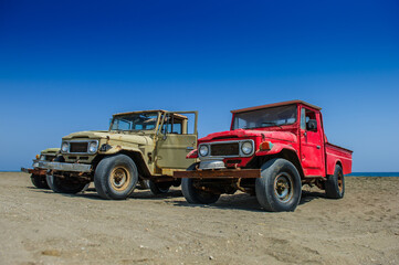 Old offroad suv car Jeep ideal for adventures with sea background