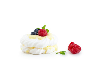 Obraz na płótnie Canvas mini Pavlova dessert with raspberries and blueberries on the table