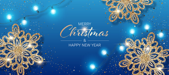 Christmas background with shiny snowflakes made of golden confetti and lights garlands. Design element for greeting card, party invitation or banner