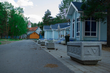 Wooden cottage in a pine forest.