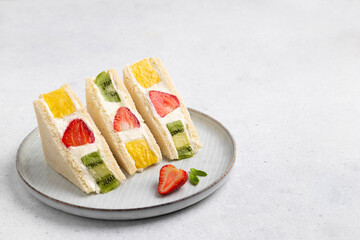 Japanese style sweet fruits sandwich with strawberry, pineapple and kiwi