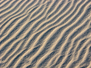 Fototapeta na wymiar Rippled sand background