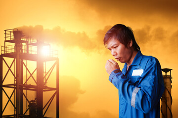 Young employee of industrial plant coughing because dust and vapor on smoke stacks, Pollution concept