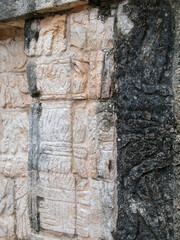 Mayan carving on an old stone wall at Chichen Itza