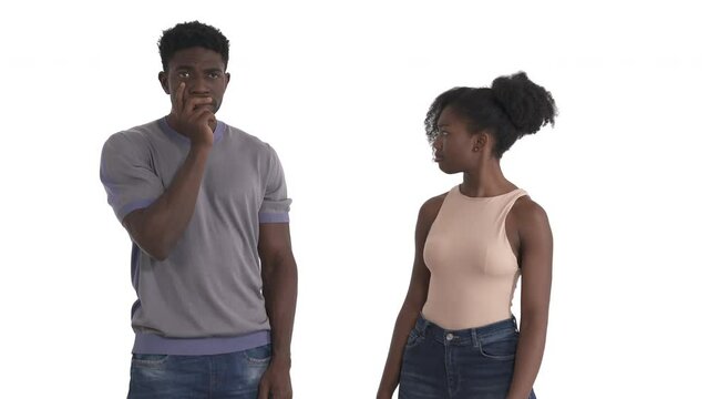 portrait of young black couple scratching their heads at a loss and in frustrated feelings isolated on white background