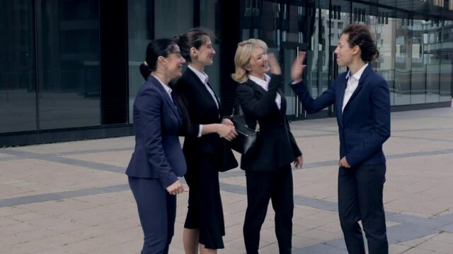 Happy woman leader motivate female employees business team give high five, excited office workers group and coach engaged in teambuilding celebrate success good results reward in teamwork concept