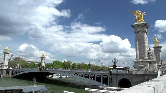 Side view of the Pont Alexandre III Bridge in Paris, France with statues / sculptures. Stock Video Clip Footage