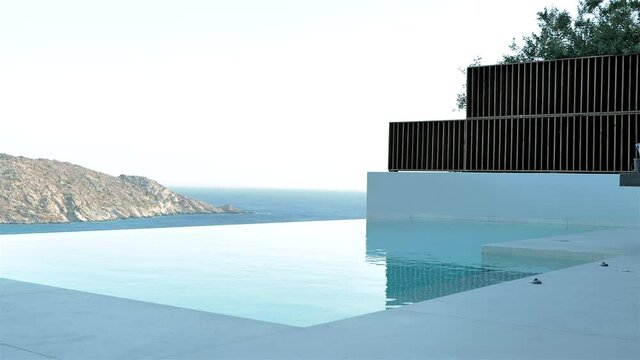 infinity pool with amazing view of greek island