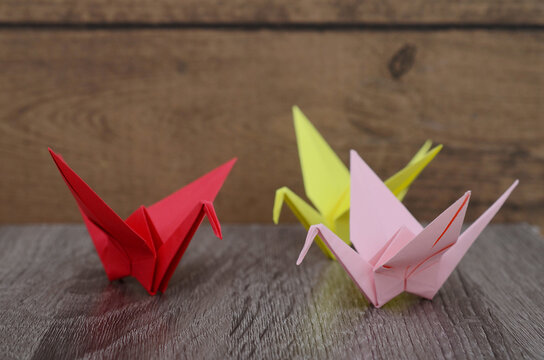 Origami cranes on wooden