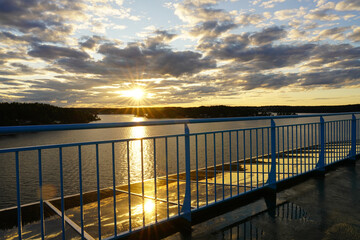 Young girl on a ferry between Stocholm and Turku. Sunset and beatiful sky.