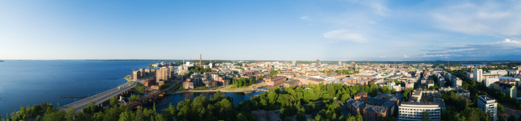 Fototapeta na wymiar Beautiful summer panorama of Tampere city at sunset. Blue sky and clouds. Finland.