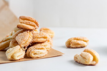 Cottage cheese and sugar cookies crows feet on white background.