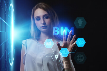 Business, Technology, Internet and network concept. Young businessman working on a virtual screen of the future and sees the inscription: BIM