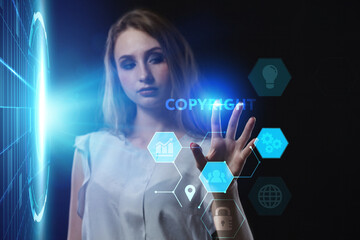 Business, Technology, Internet and network concept. Young businessman working on a virtual screen of the future and sees the inscription: Copyright