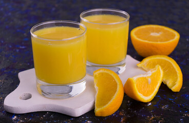 Two glasses of fresh organic orange juice.
Close-up.