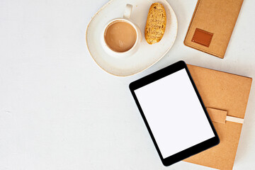 Styled minimal desktop mockup with organic color stationary, coffee cup, notepad. Freelancer, social media blogger concept. Flat lay, top view