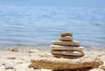 Several stones  on one against the background of the blue sea in the south of Ukraine. Leisure and vacation concept. The see is quite and calm