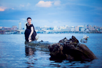 Picture of a middle-aged woman. Concept of emotions. Woman is happy to have rest outdoors after...